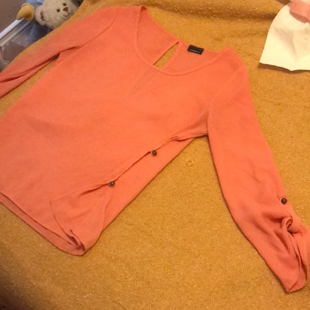 Long sleeve coral shirt with buttons down the side